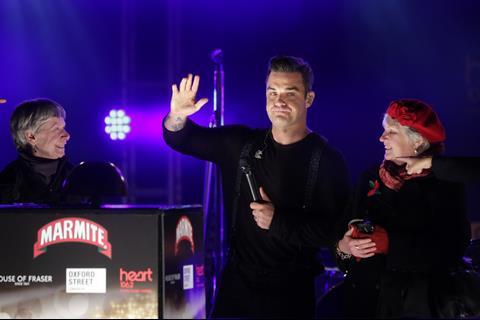 Robbie presses the button to switch on the 300,000 bulbs